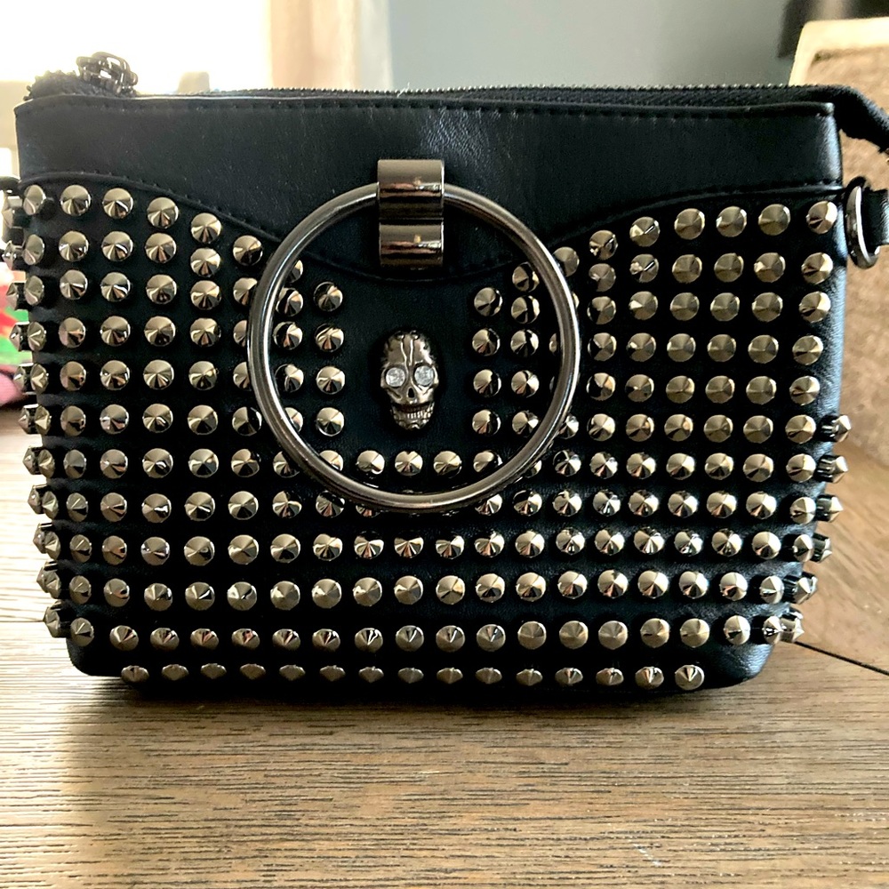 Black studded handbag with skull detail